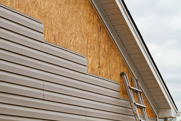 Professional Siding Installation technician working in Pinehurst, MA
